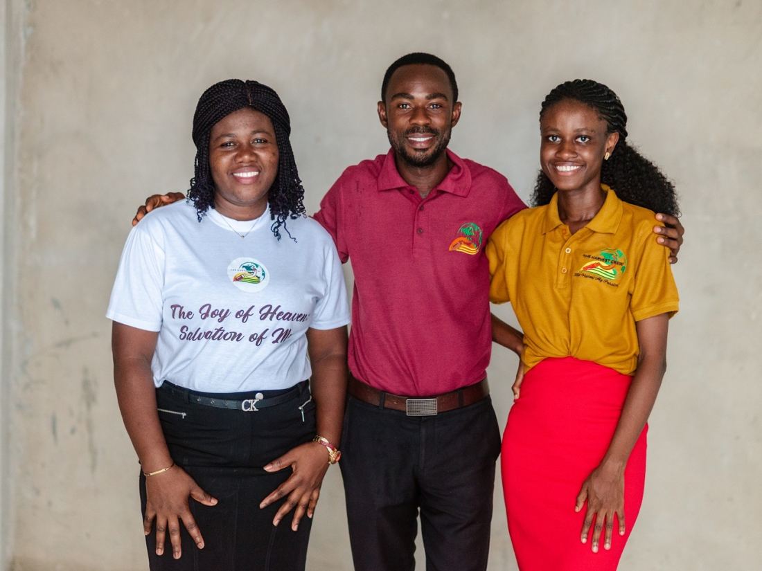 Three members of The Harvest Crew in their branded shirts