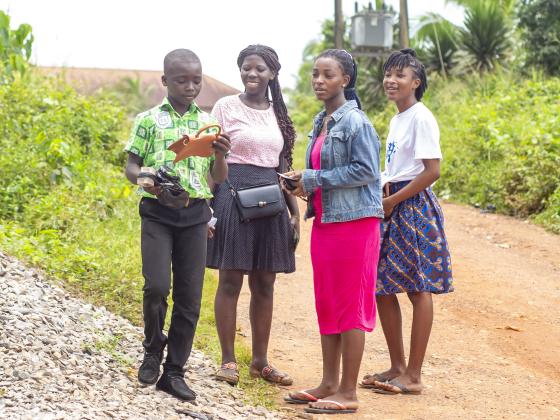 The crew speaking with residents along the roadside