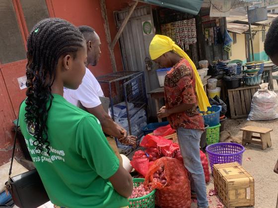 Reaching a trader at her market stall