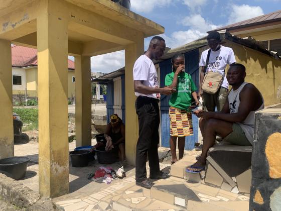 Gathered under a shelter to share the Gospel